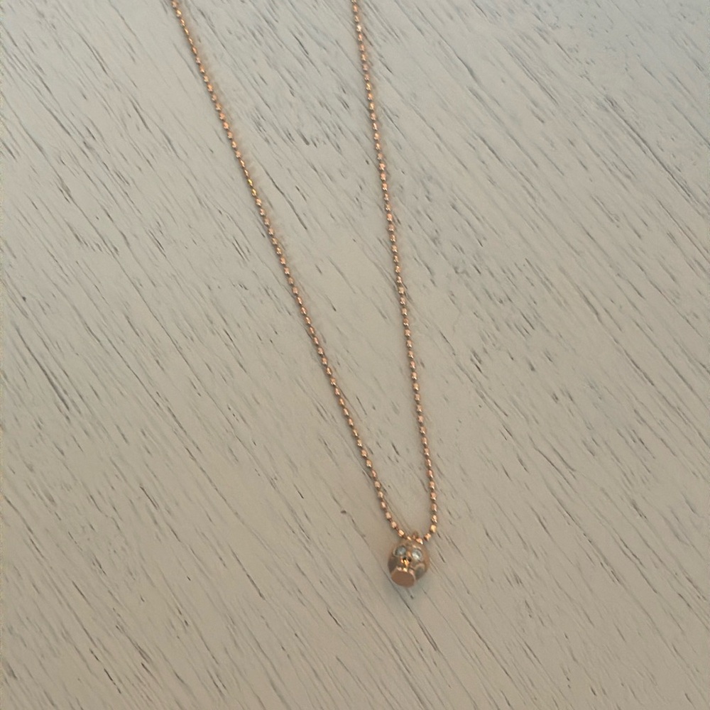 Gold skull and diamond necklace